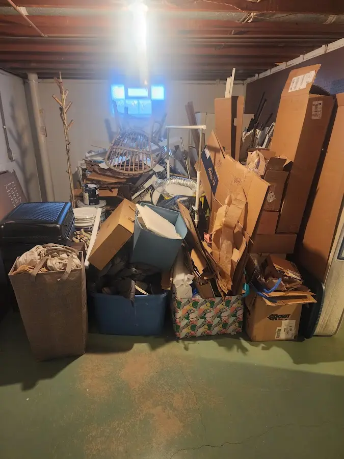 Roll-off dumpster container at job site for 6 Yard Dumpster Rental in Newton